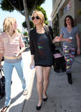 Lindsay Lohan shows her legs in short skirt walking in Beverly Hills