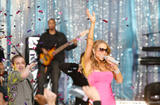 Mariah Carey performs in small body-hugging pink dress showing big cleavage and legs at ABC's Good Morning America in New York